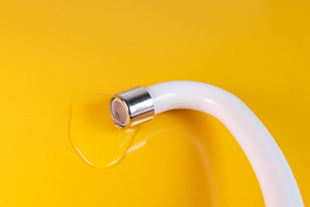 A clean white faucet for toilets unblocking.